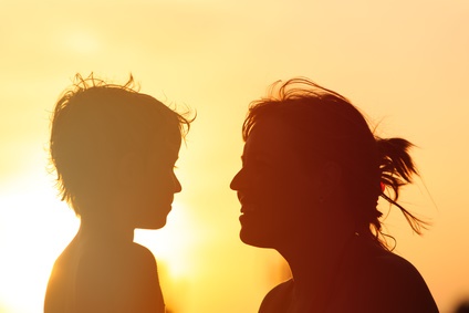 happy mother and son at sunset sunlight